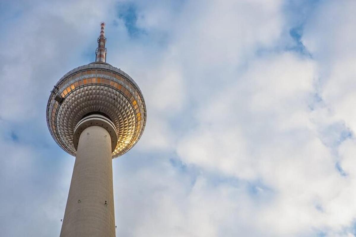 a tall building with a pole in the sky