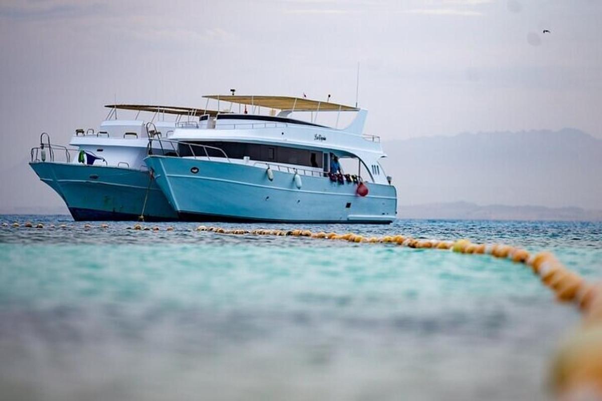 a boat sitting on the water in the ocean
