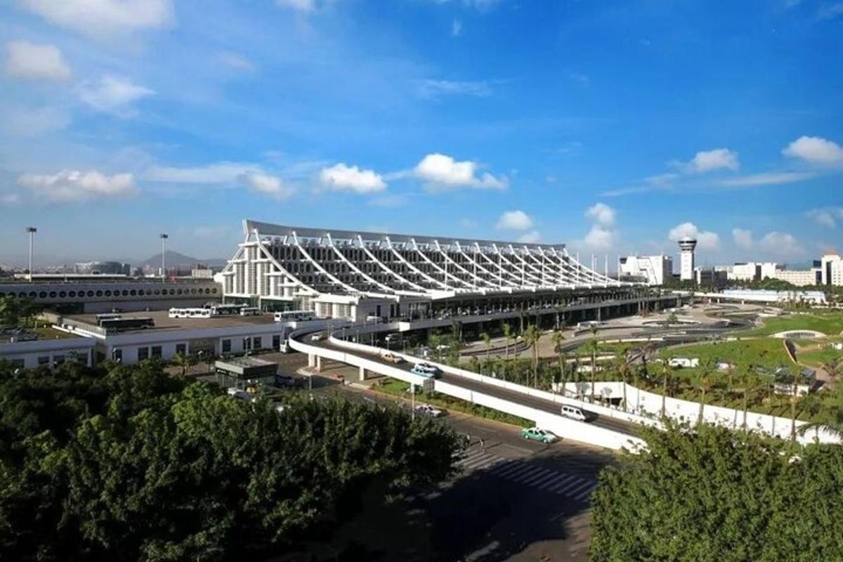 a large building with a road in a city