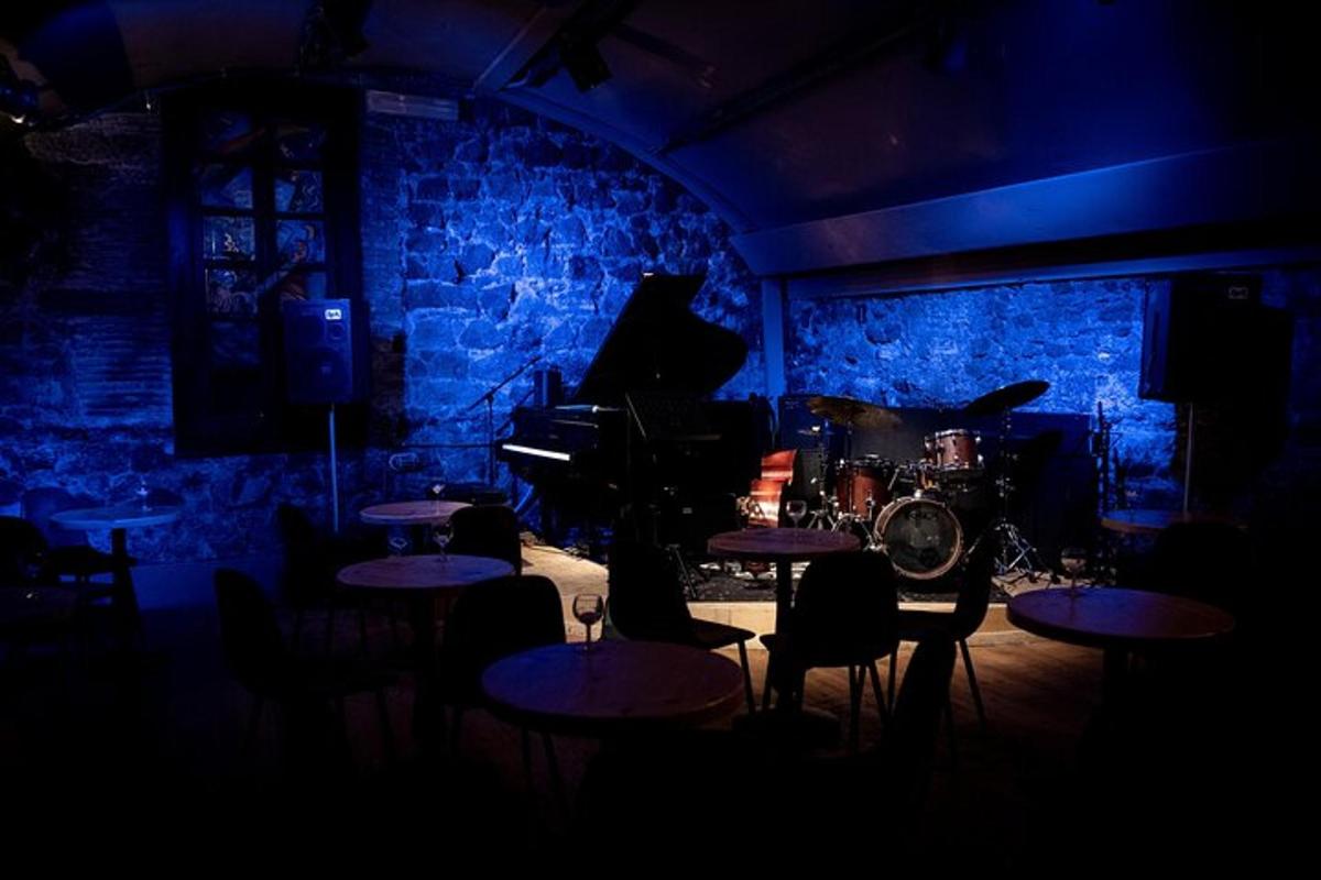 a room with tables and a piano in a room