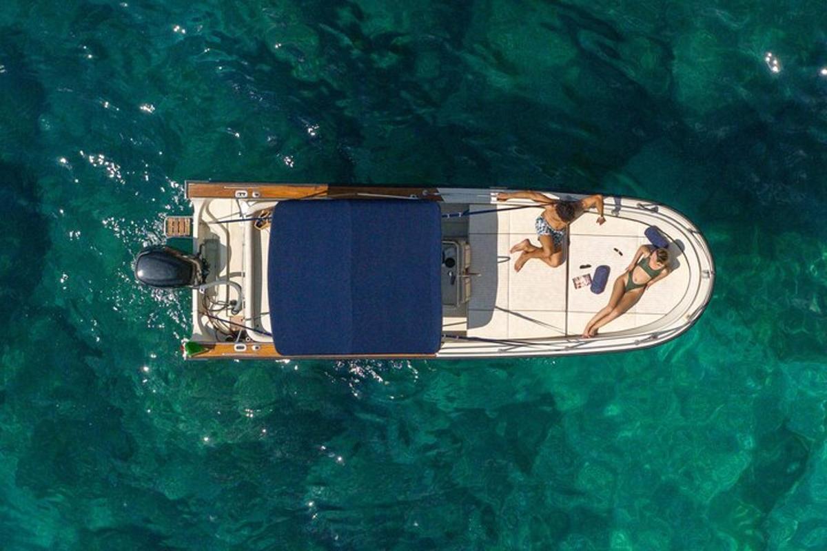 two people on a boat in the water