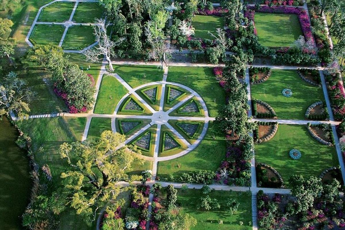 an overhead view of a garden with a large windmill