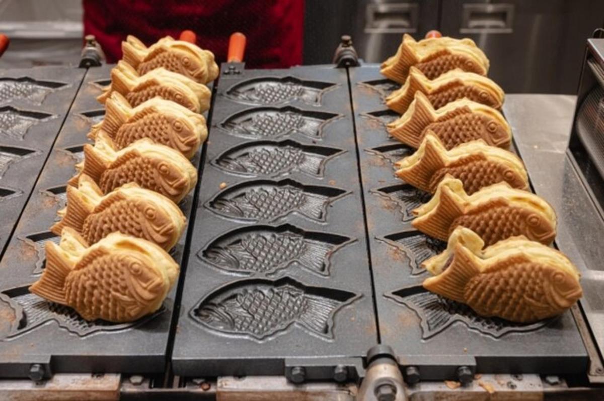 a bunch of pastries sitting on a grill
