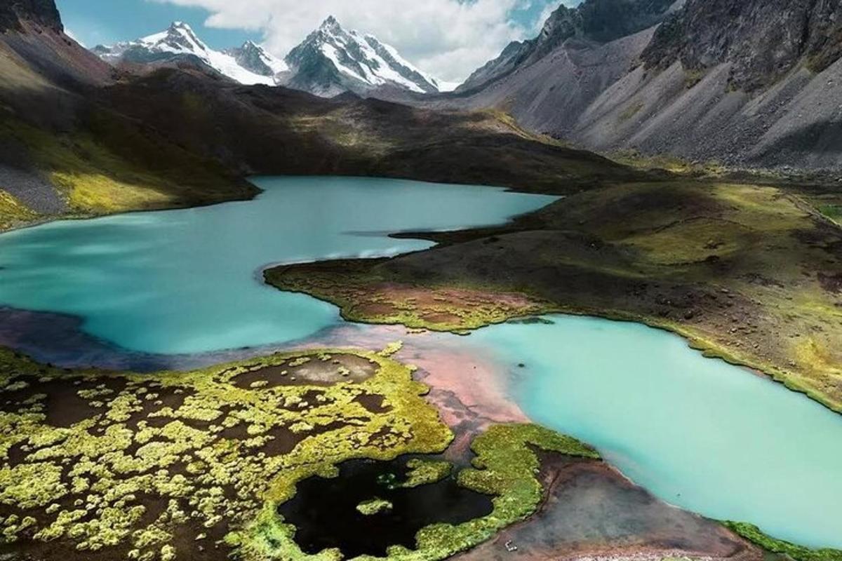 an aerial view of a lake in the mountains