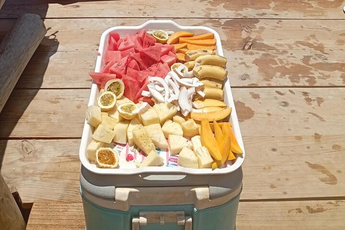 a container filled with different types of vegetables on a table