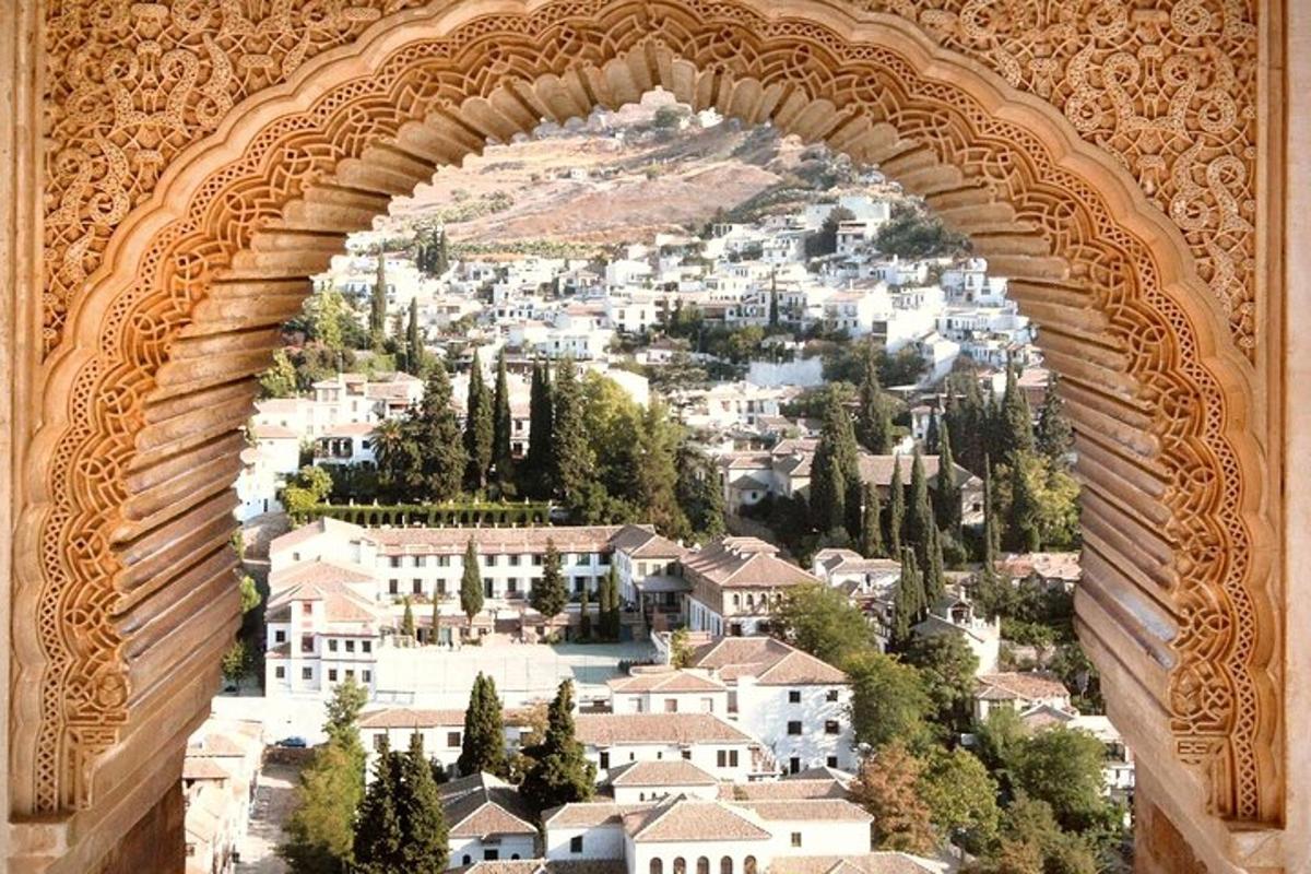 a view of a city through a stone archway
