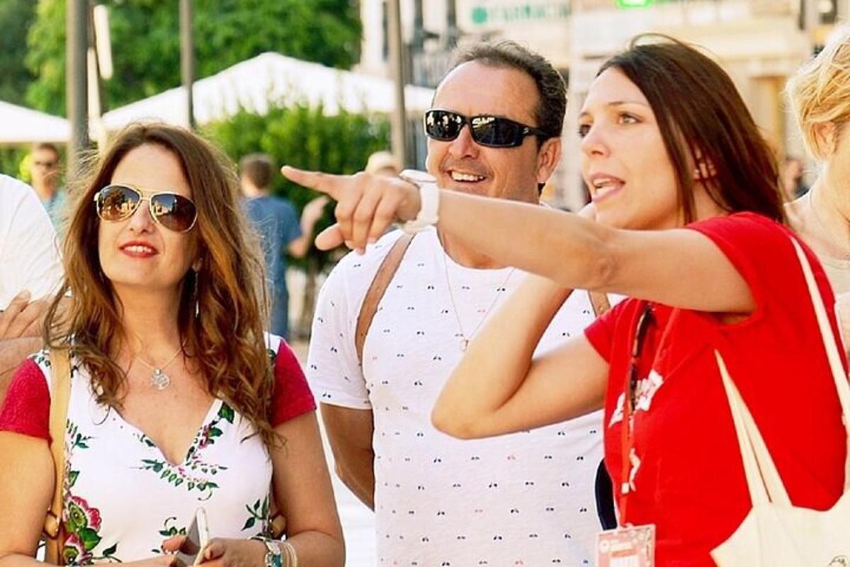a group of people looking at a woman pointing