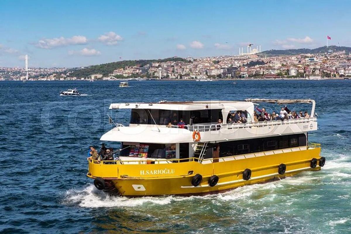 a yellow and white boat in the water