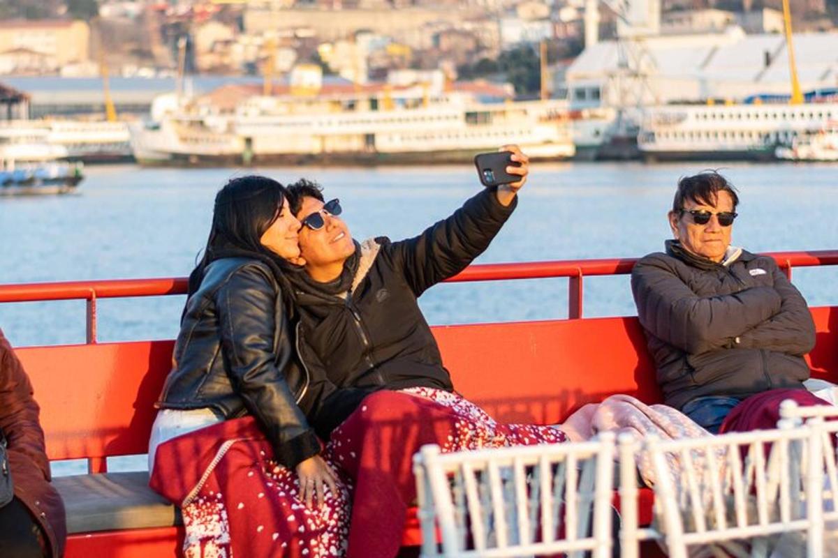 a group of people sitting on a boat taking a picture