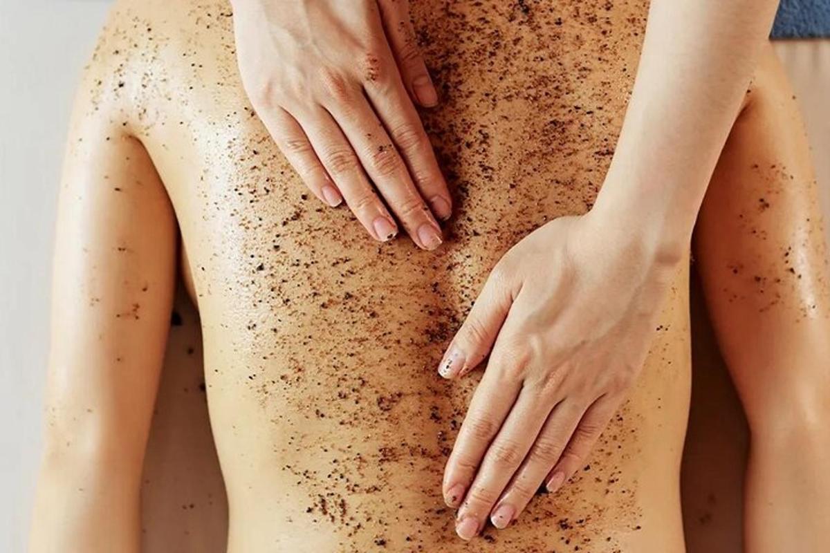 a man and a woman with her hands on her back