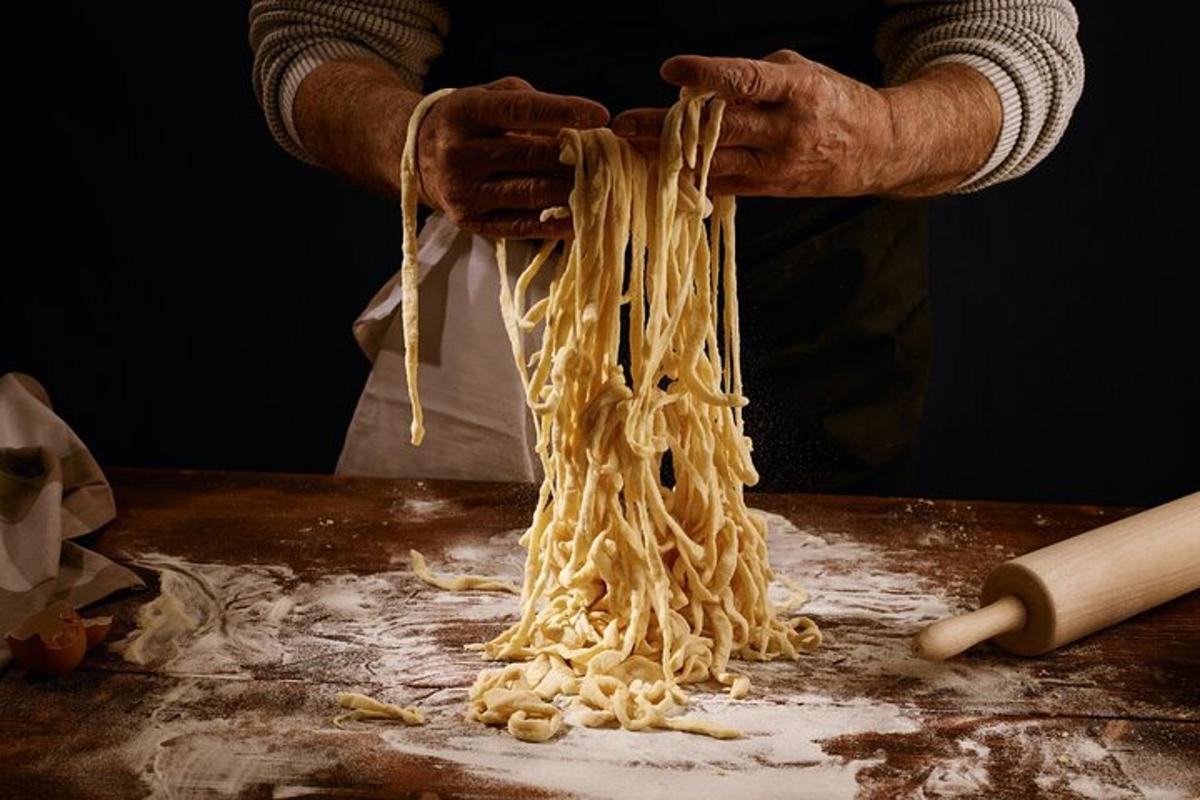 a person is making pasta on a table