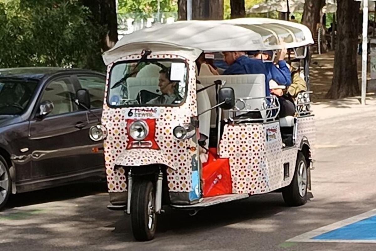 a group of people riding in a golf cart