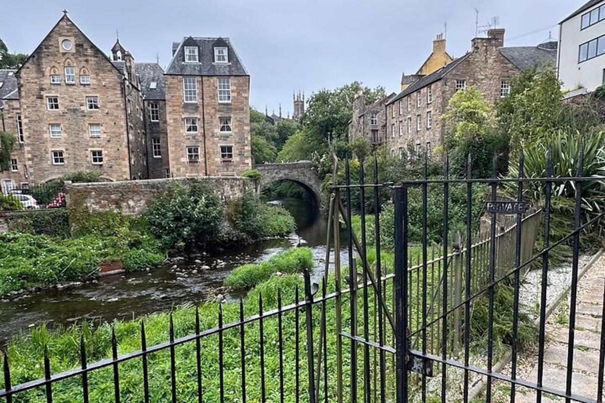 a bridge over a river in a city with buildings