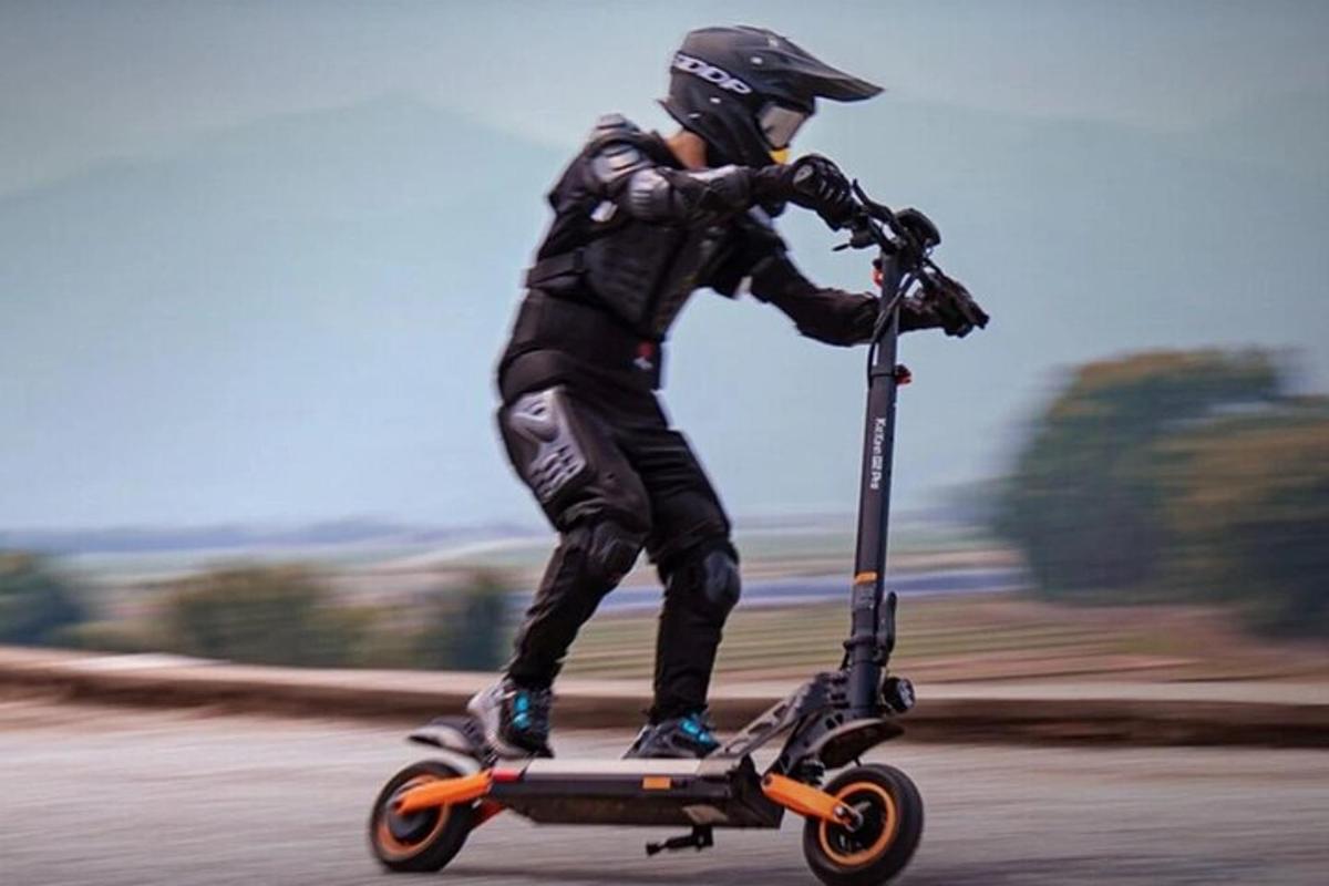 a person riding a scooter on the road