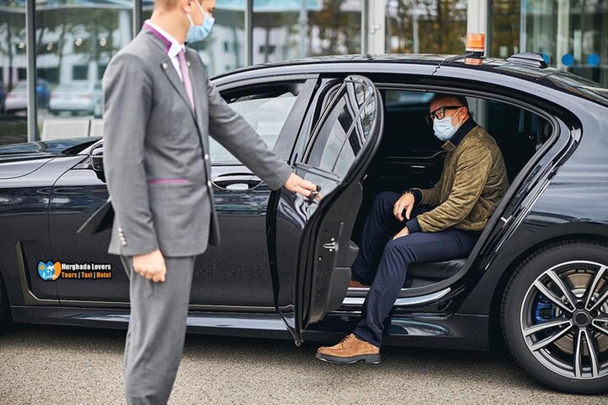 a man wearing a mask standing next to a car