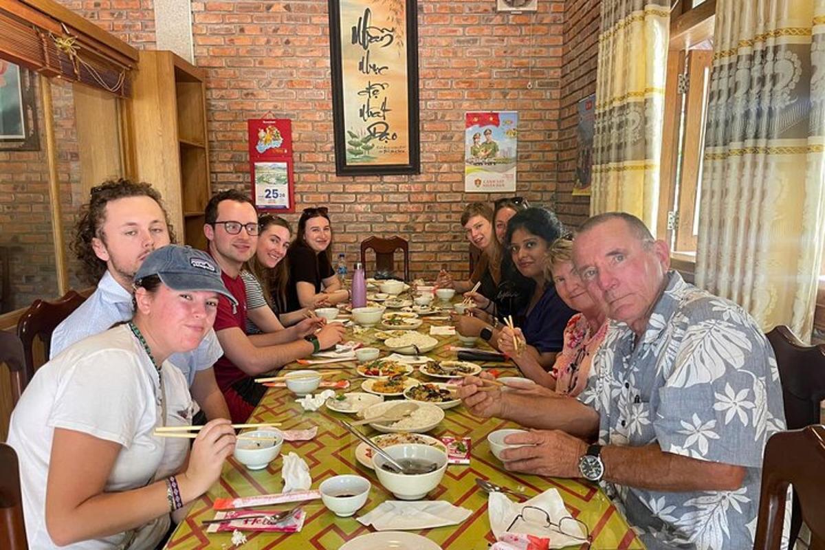 a group of people sitting at a table eating
