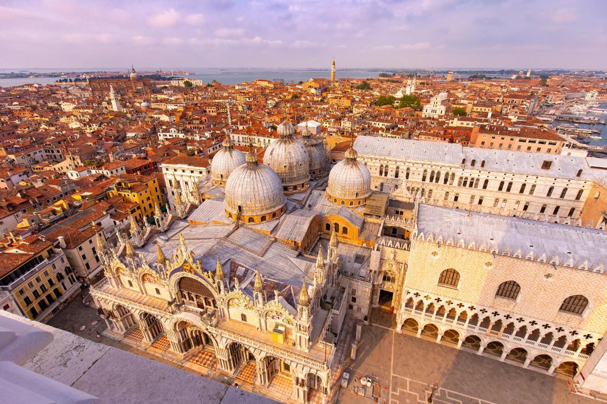 an aerial view of a cathedral and a city