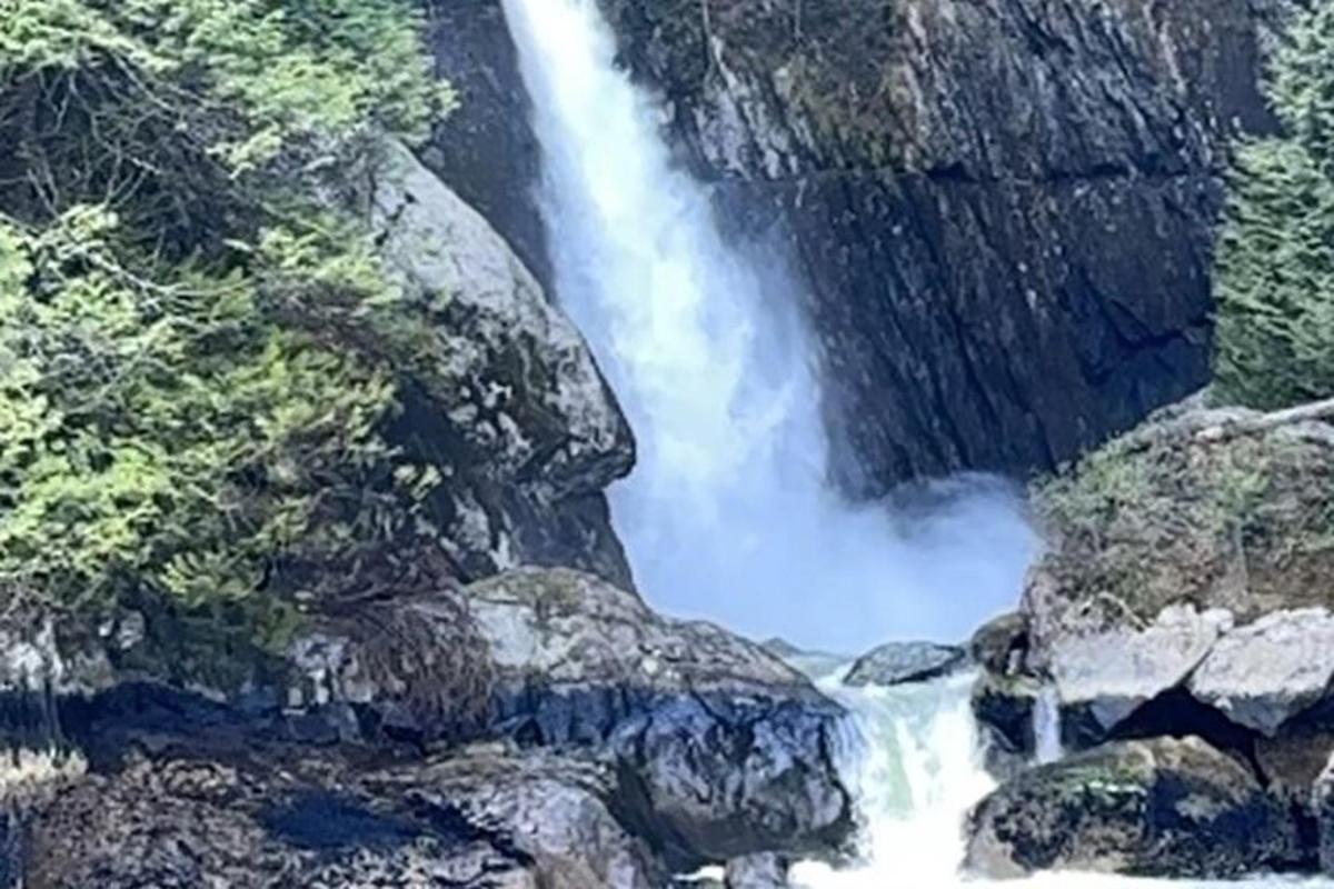a waterfall in the middle of a river