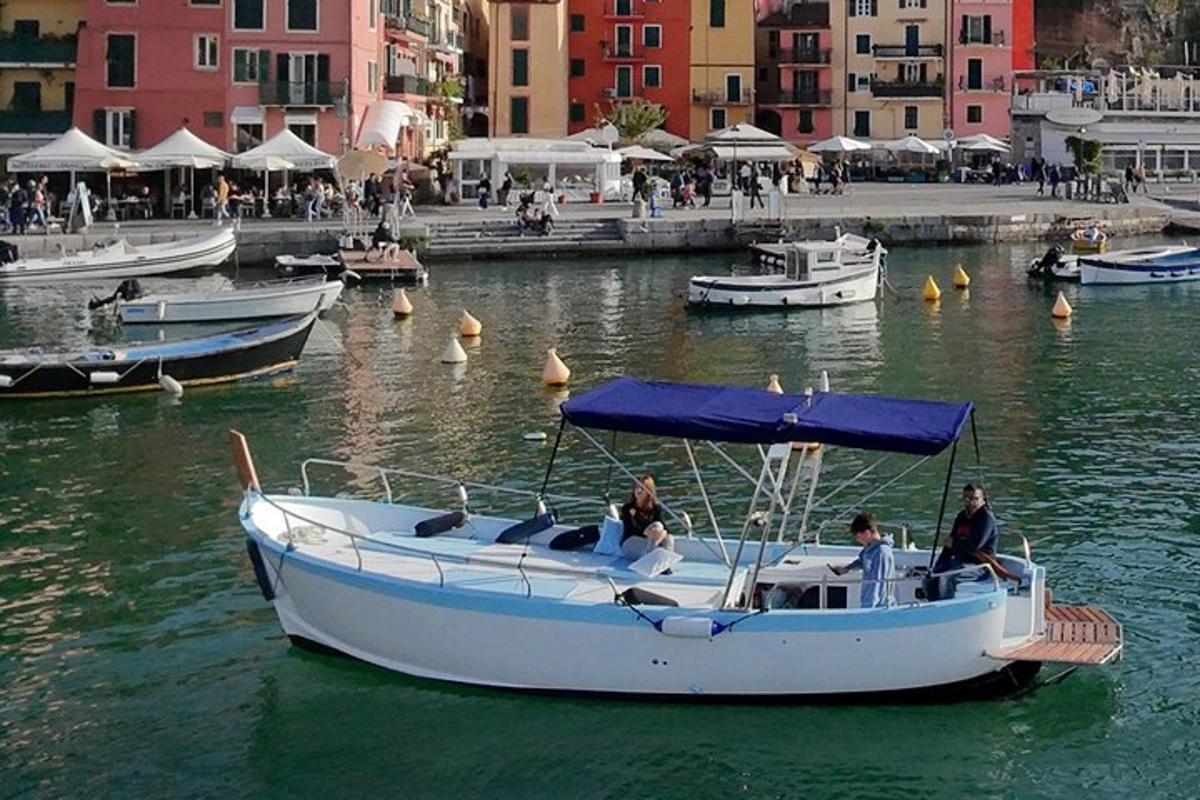 a group of people in a boat in the water