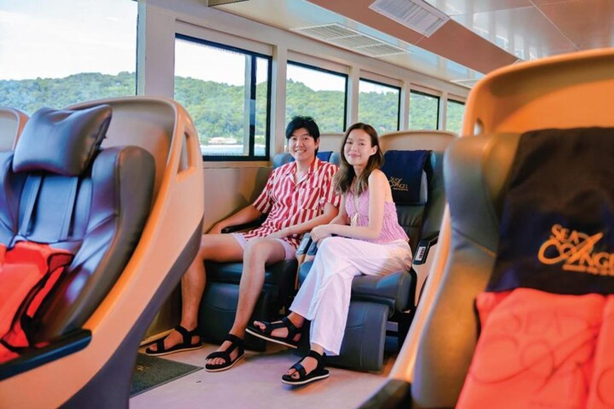 a man and woman sitting on a bus