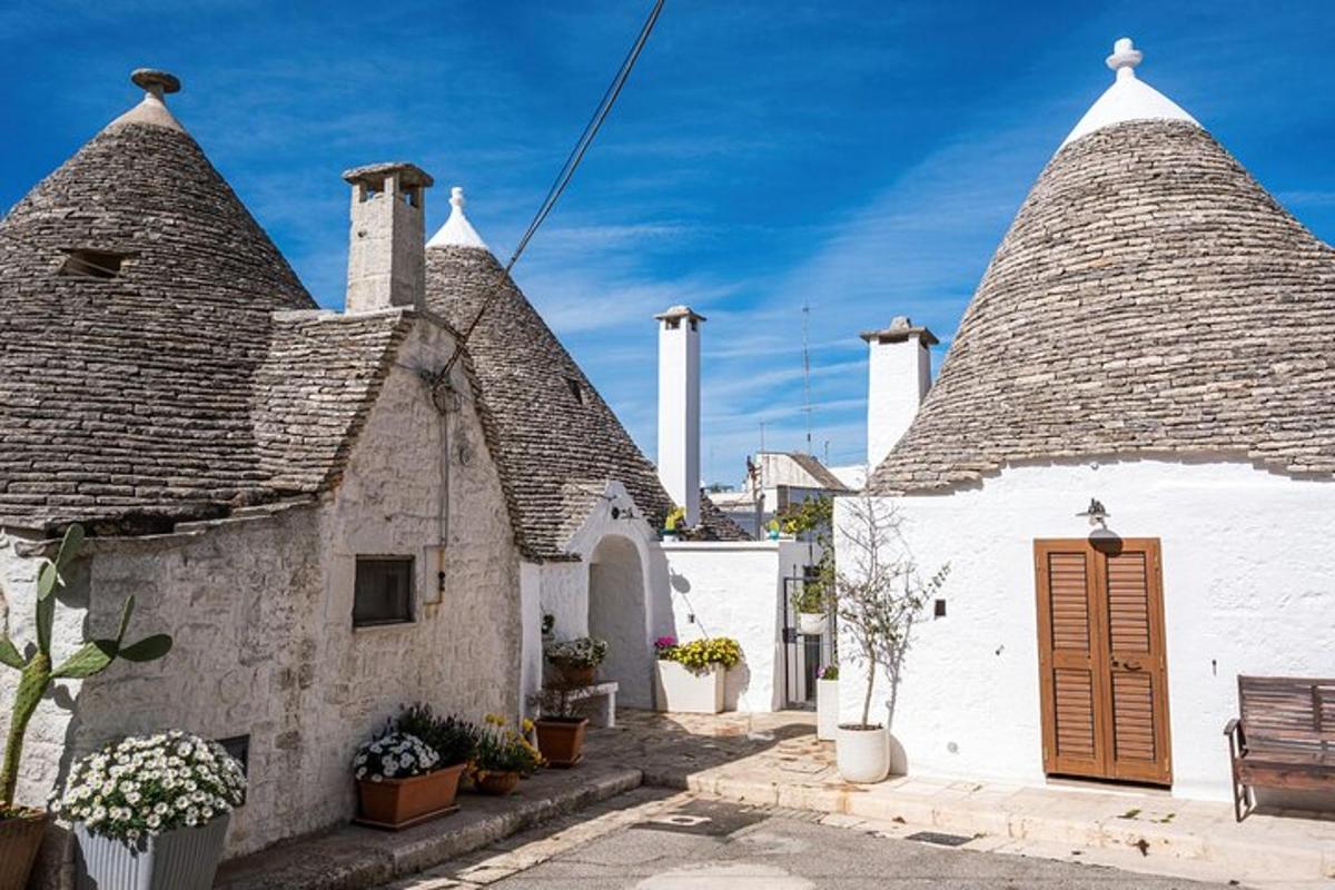 a group of white buildings with a roof
