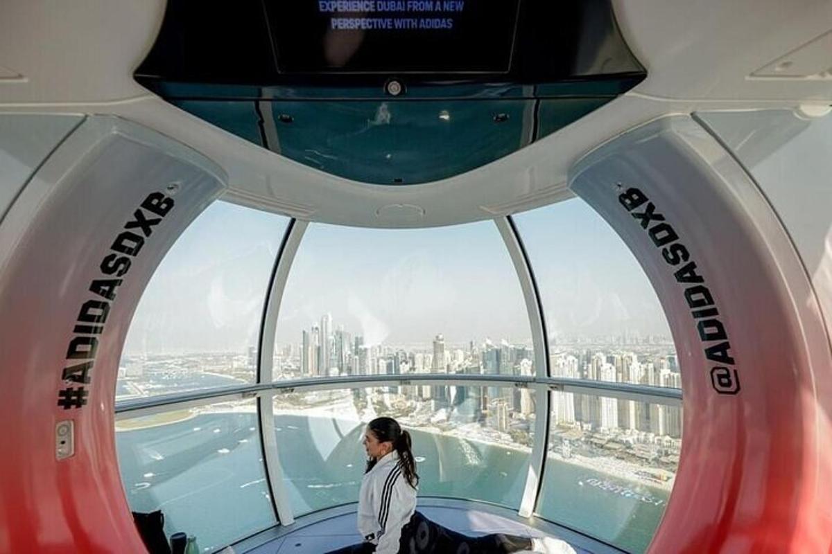 a woman stands in the observation deck of the shanghai tower