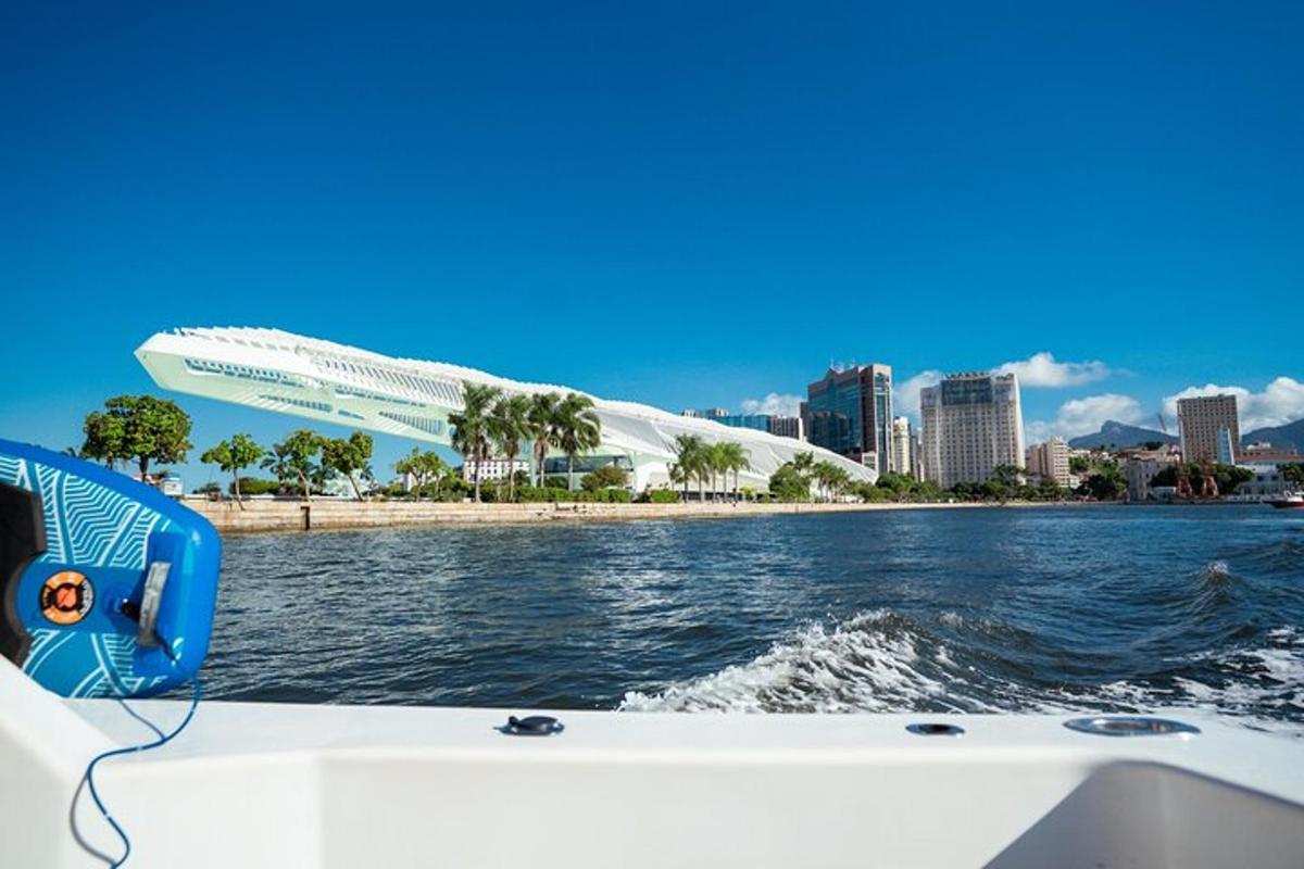 a boat in the water with a view of a city