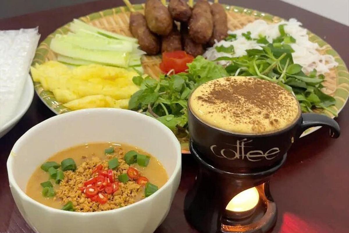 a plate of food with a cup of coffee and a plate of food