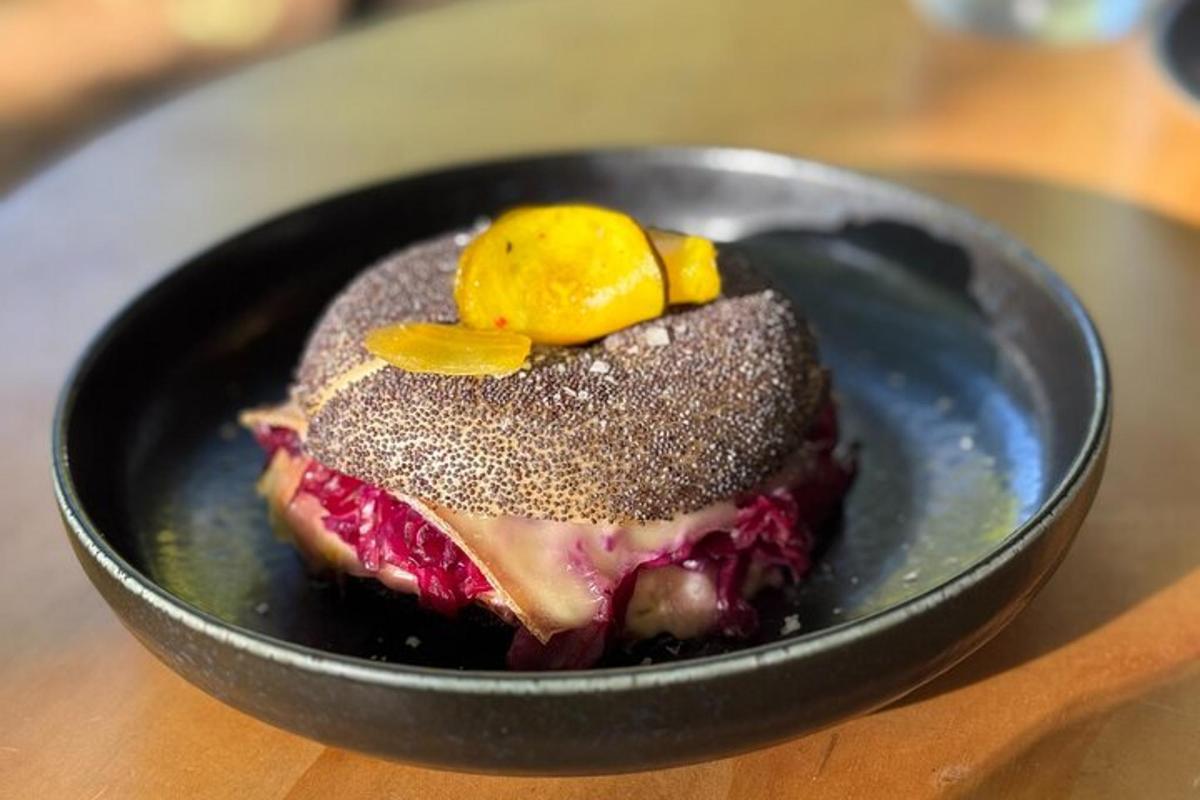 a black bowl with a dessert on a table