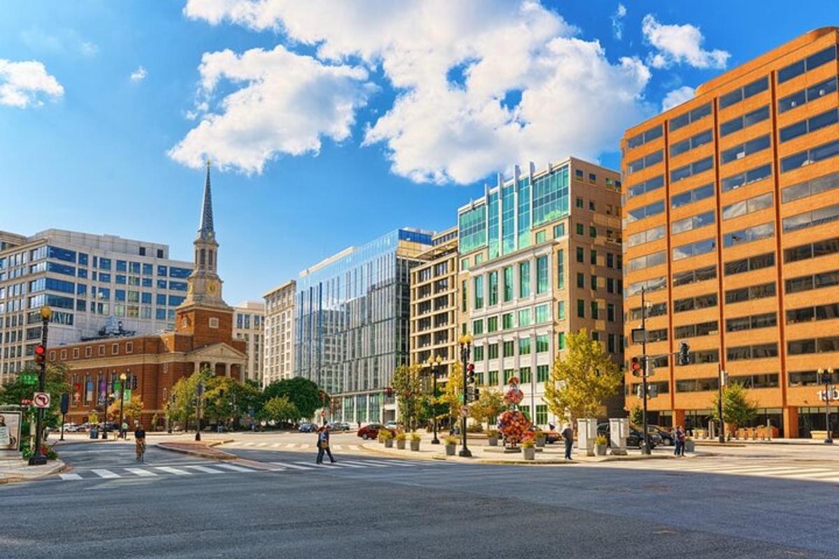 a city with buildings and a street with a crosswalk