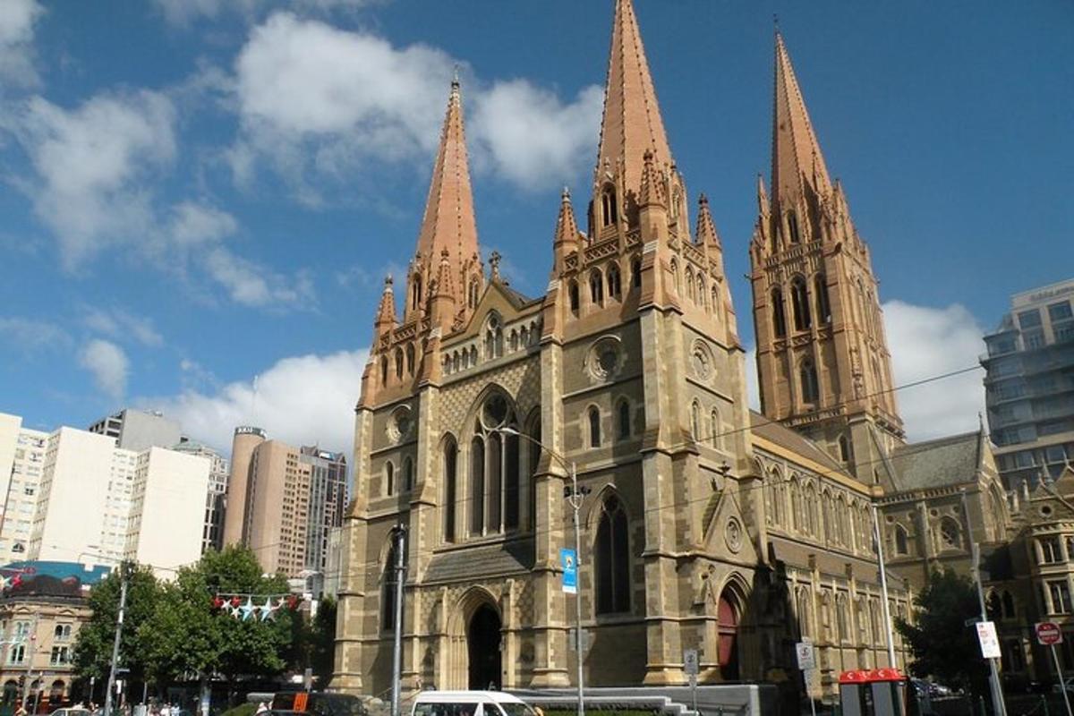 an old church with two towers on a city street