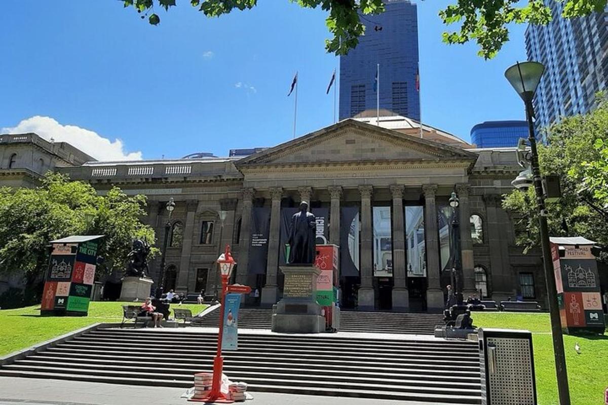 a large building with a statue in front of it