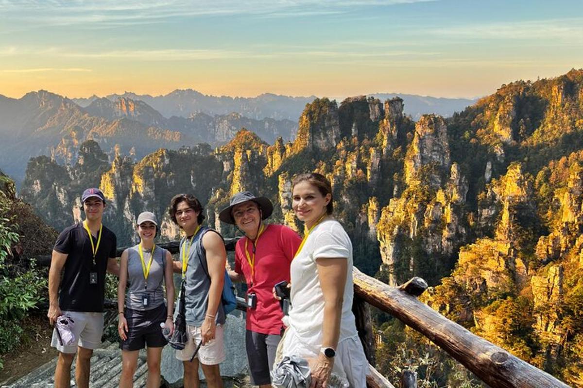 a group of people standing at the top of a mountain