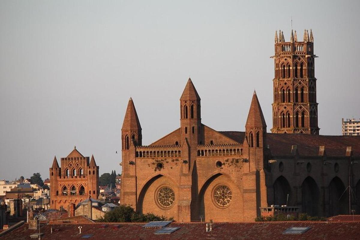a large brick church with two towers and a cathedral