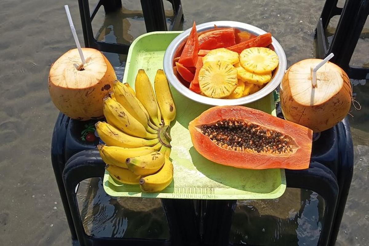a table with a plate of fruit and vegetables