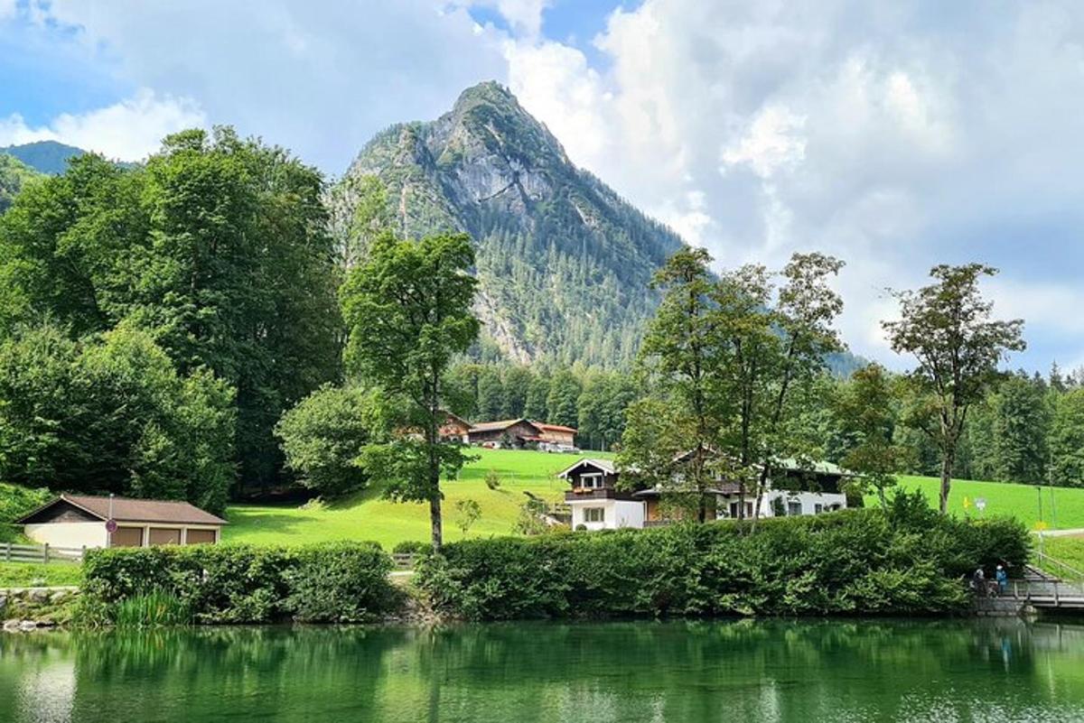 a view of a mountain with houses and a lake