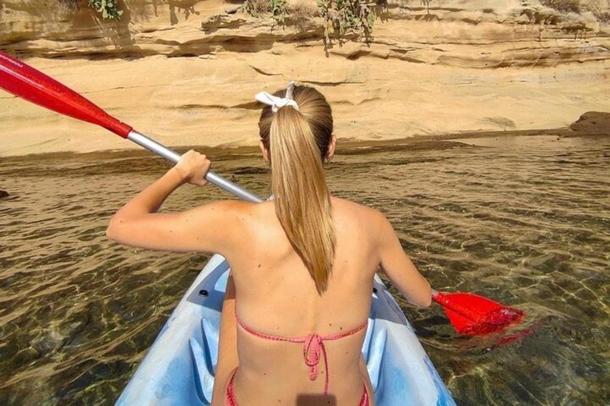 a woman in a kayak in the water