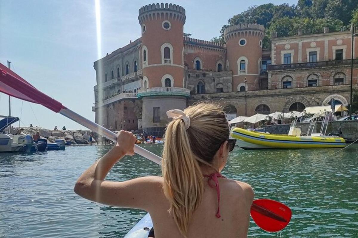 a woman is rowing a boat in the water