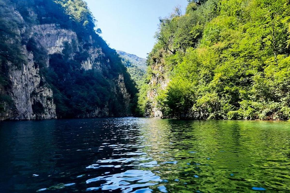 a view of a river in a canyon with trees