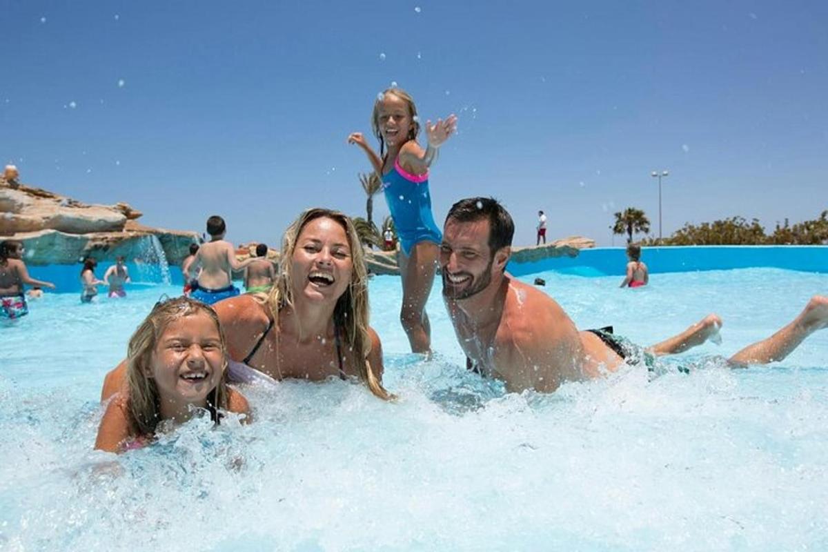 a group of people in the water at a swimming pool