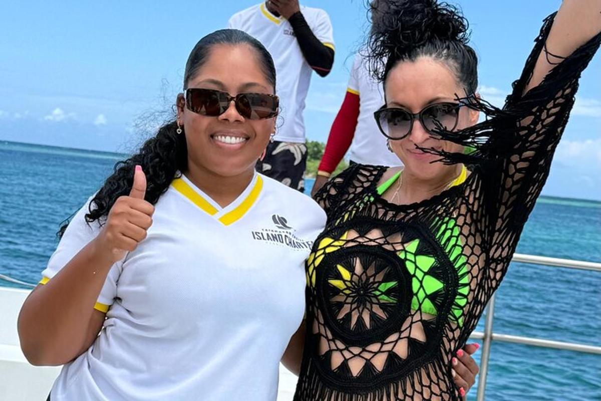 two women posing for a picture on a boat