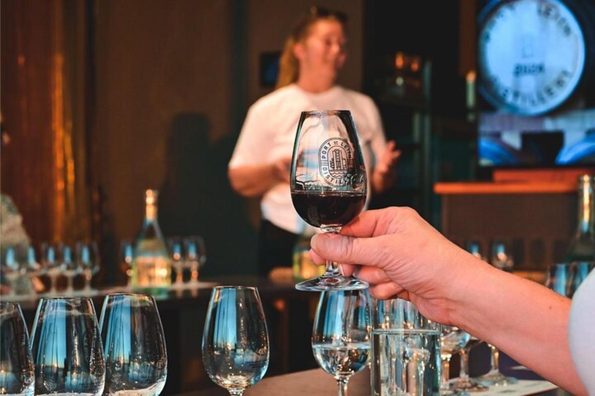 a person holding up a glass of wine