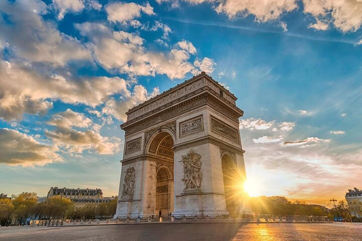 a monument in a square with the sunset in the background