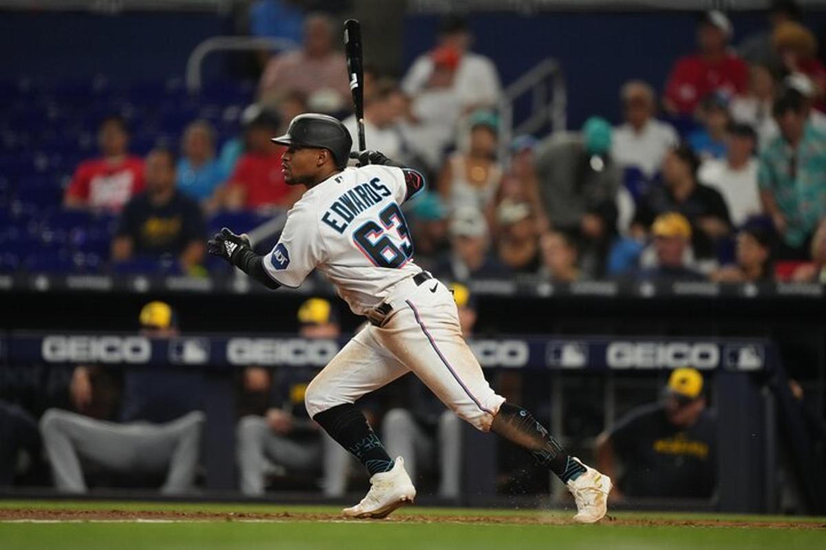 a baseball player holding a bat on a field