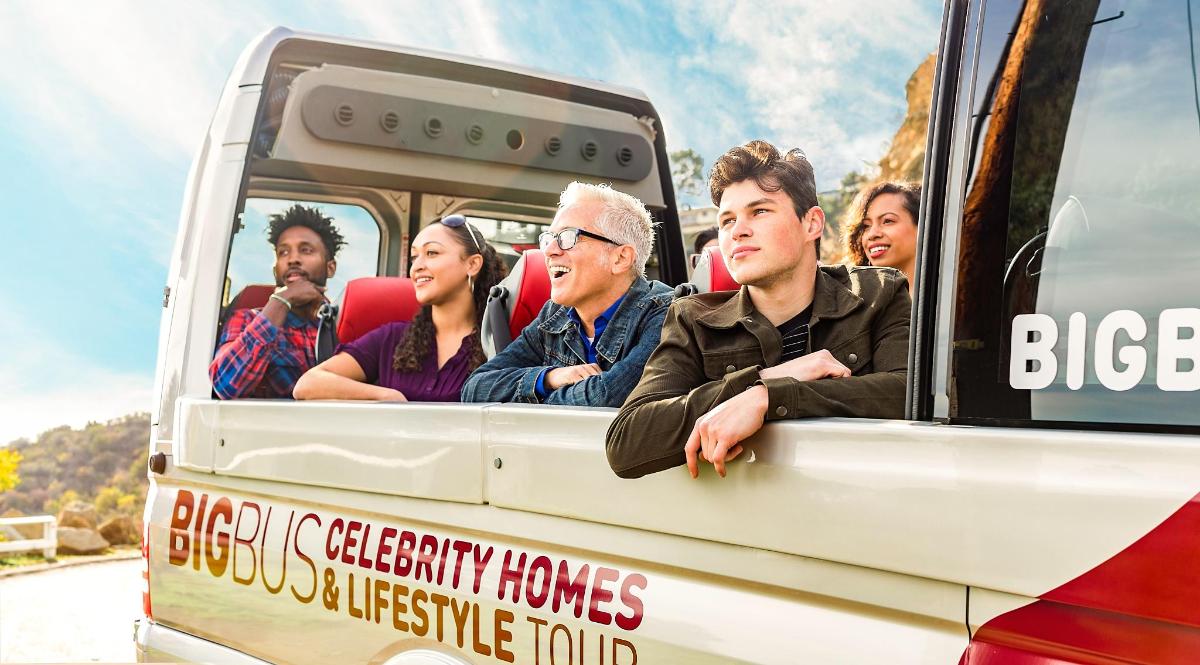 a group of people sitting in the back of a bus