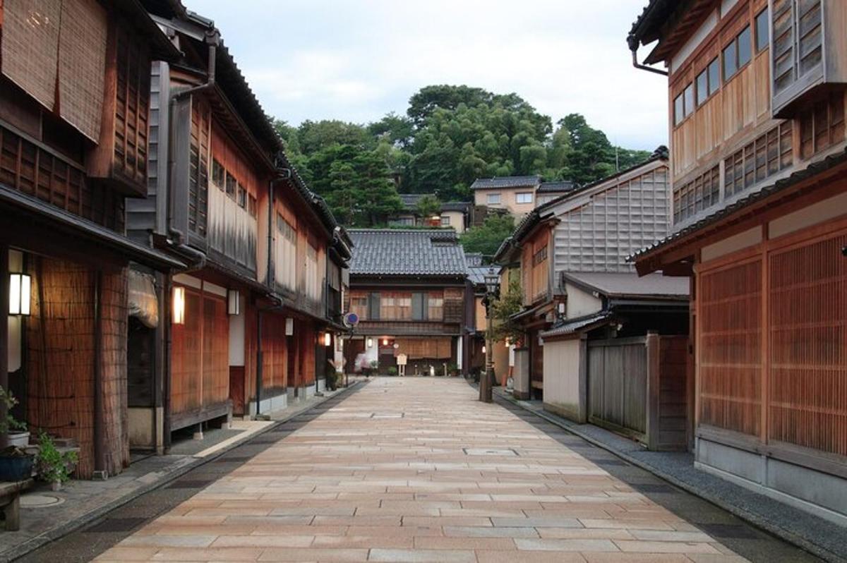 an alley in an old town with wooden buildings