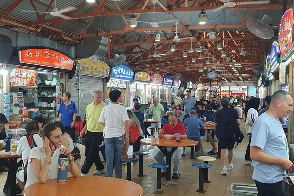 a group of people sitting at tables in a restaurant