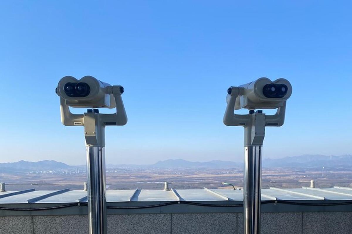 two security cameras on top of a building
