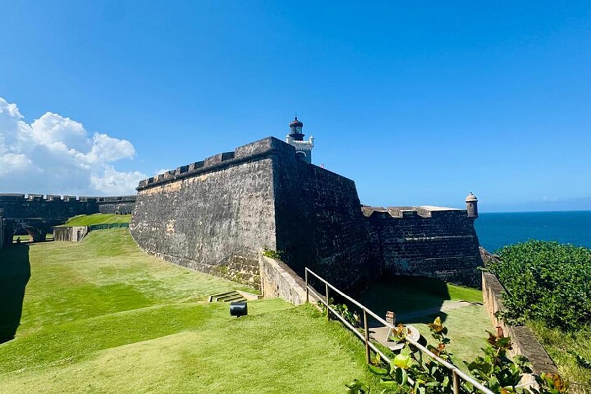 a large castle with the ocean behind it