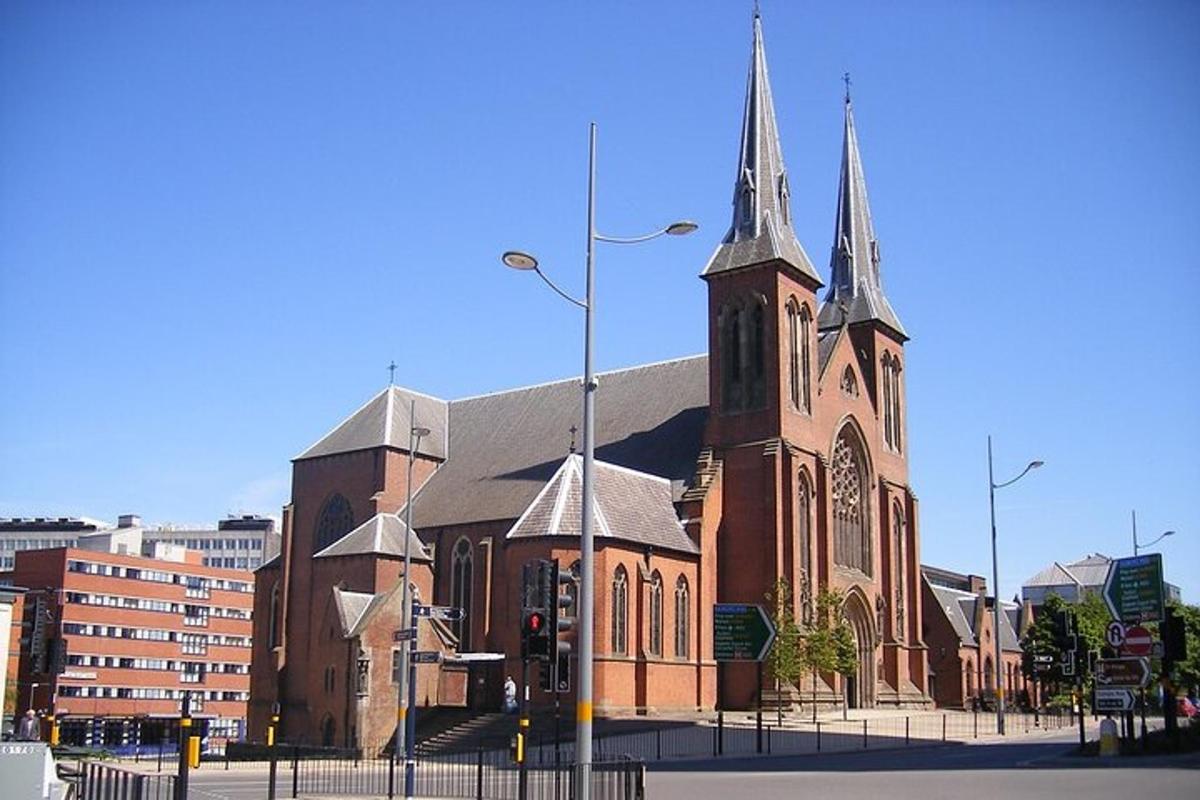 a large brick church with a steeple on a street